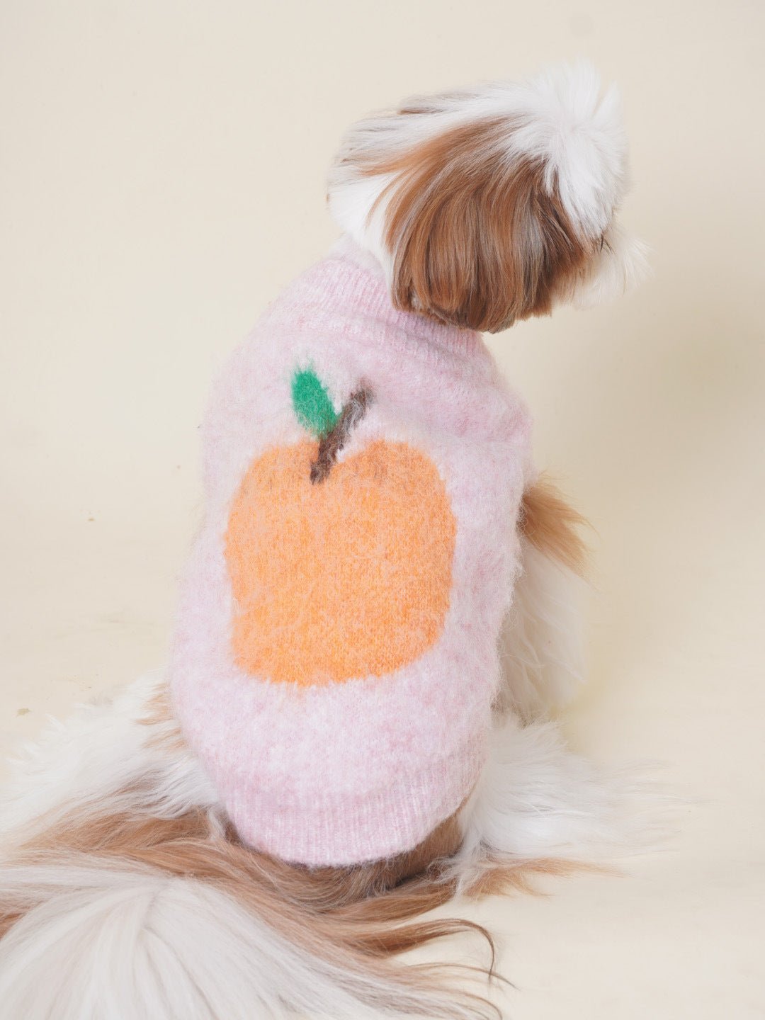 Stacked pile of colorful high-neck knitted dog sweaters, variety of warm pet apparel options