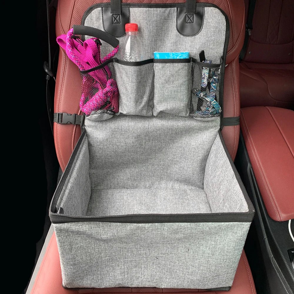 Close-up of pet car seat showing side storage pocket and sturdy safety straps for pets