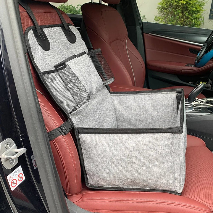 Empty elevated dog car seat with storage, showcasing easy installation straps for car console