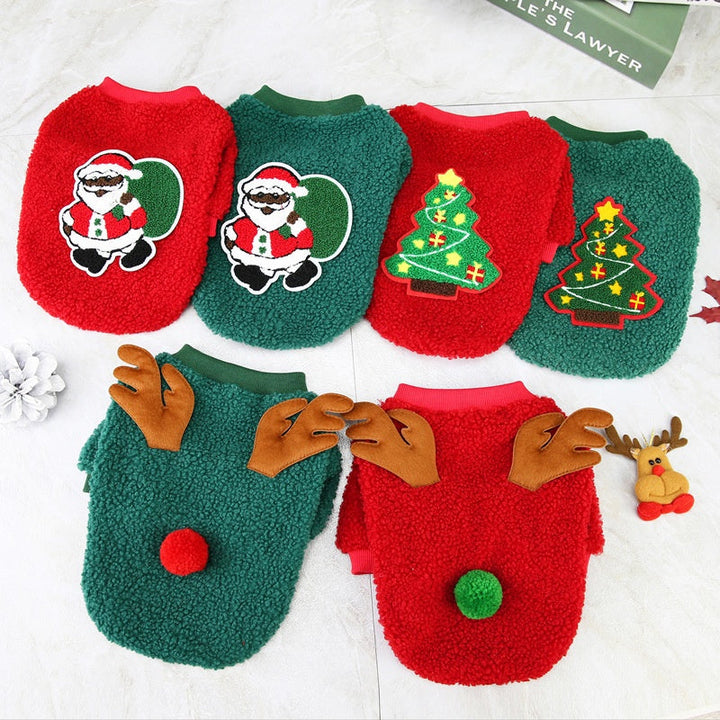 Joyful terrier mix wearing a cozy green fleece dog Christmas sweater, perfect for winter pet comfort.