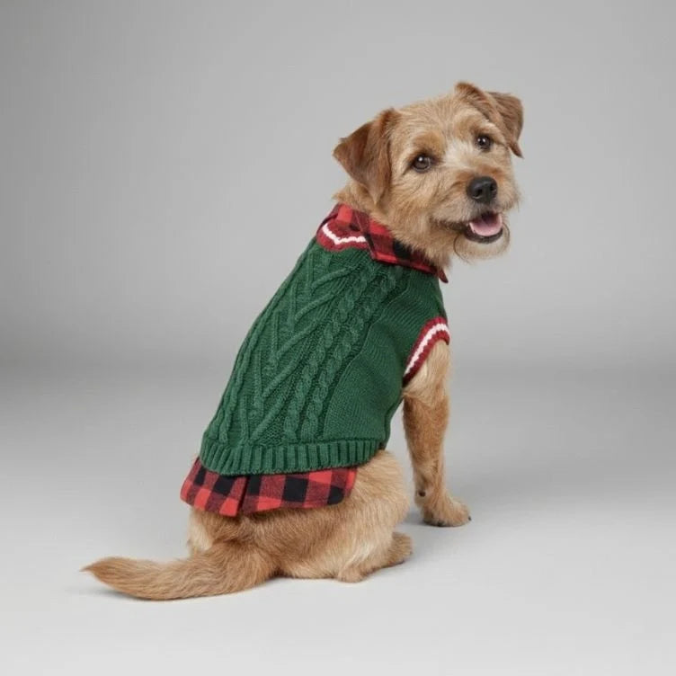 Close-up of cable knit pattern on a dog sweater vest with a contrasting plaid collar.
