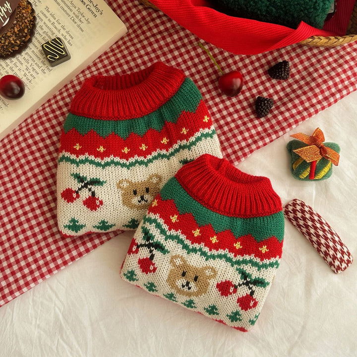Close-up of snowflake pattern on red 'Cozy Pet Christmas Sweater', warm pet clothing for small dogs