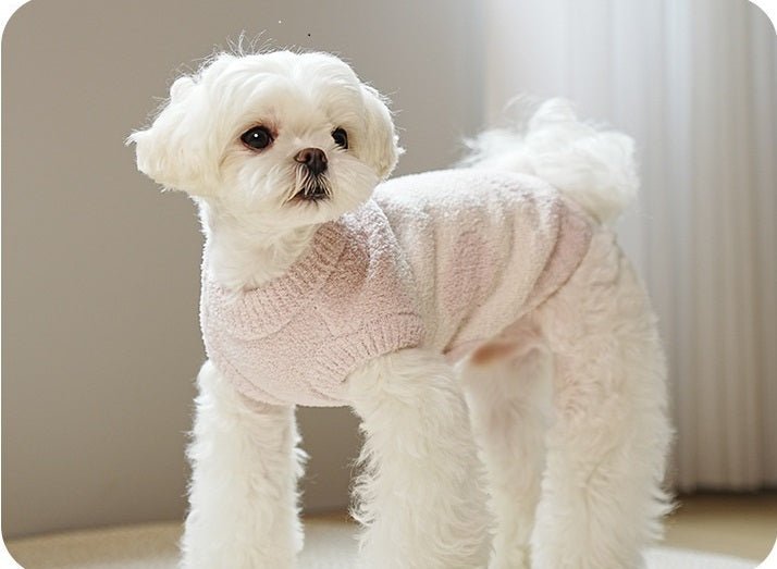 Cute puppy in a blue fleece dog sweater, designed for warmth and stretch in pet clothing.