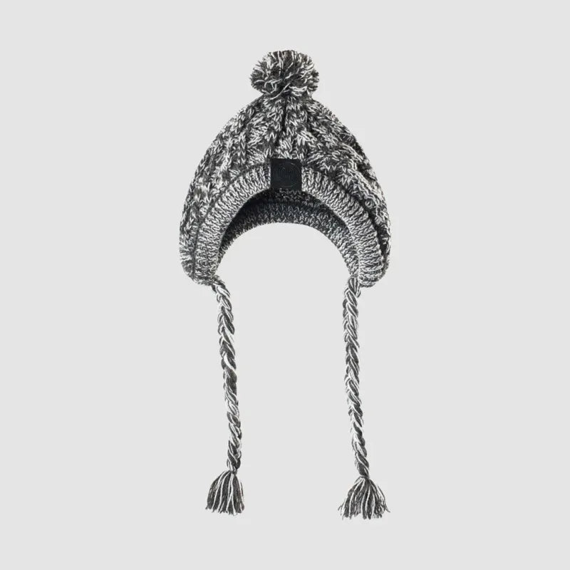 Happy dog wearing a comfy grey knitted winter hat with a pom-pom, perfect for cold days.