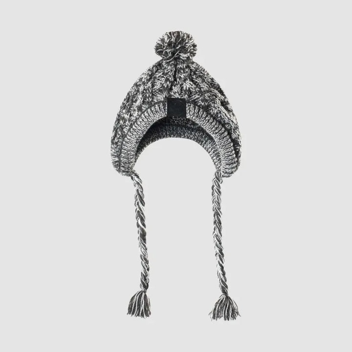 Happy dog wearing a comfy grey knitted winter hat with a pom-pom, perfect for cold days.