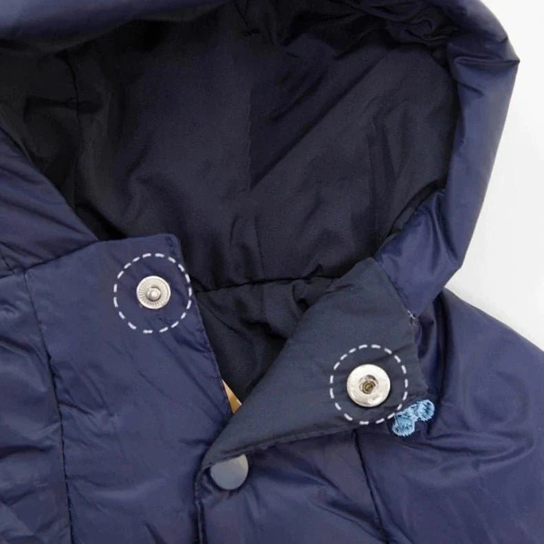 Front view of a warm dog jumpsuit jacket, bear pattern detail, essential winter pet wear.