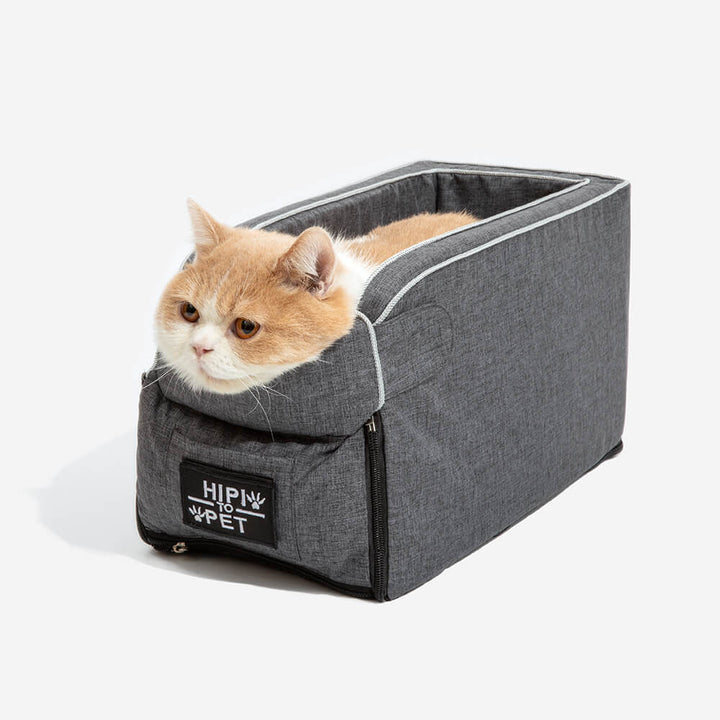 Small grey suede dog car seat for console; comfortable pet travel accessory for small dogs.