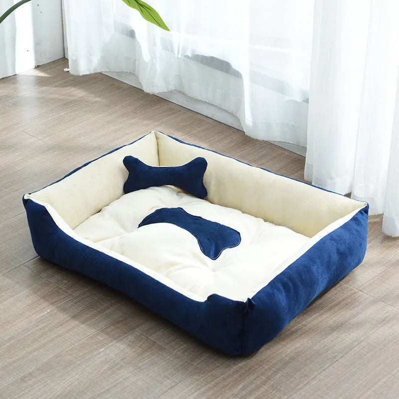 Small dog peacefully sleeping in a raised edge calming pet bed, with the bone pillow nearby for support.