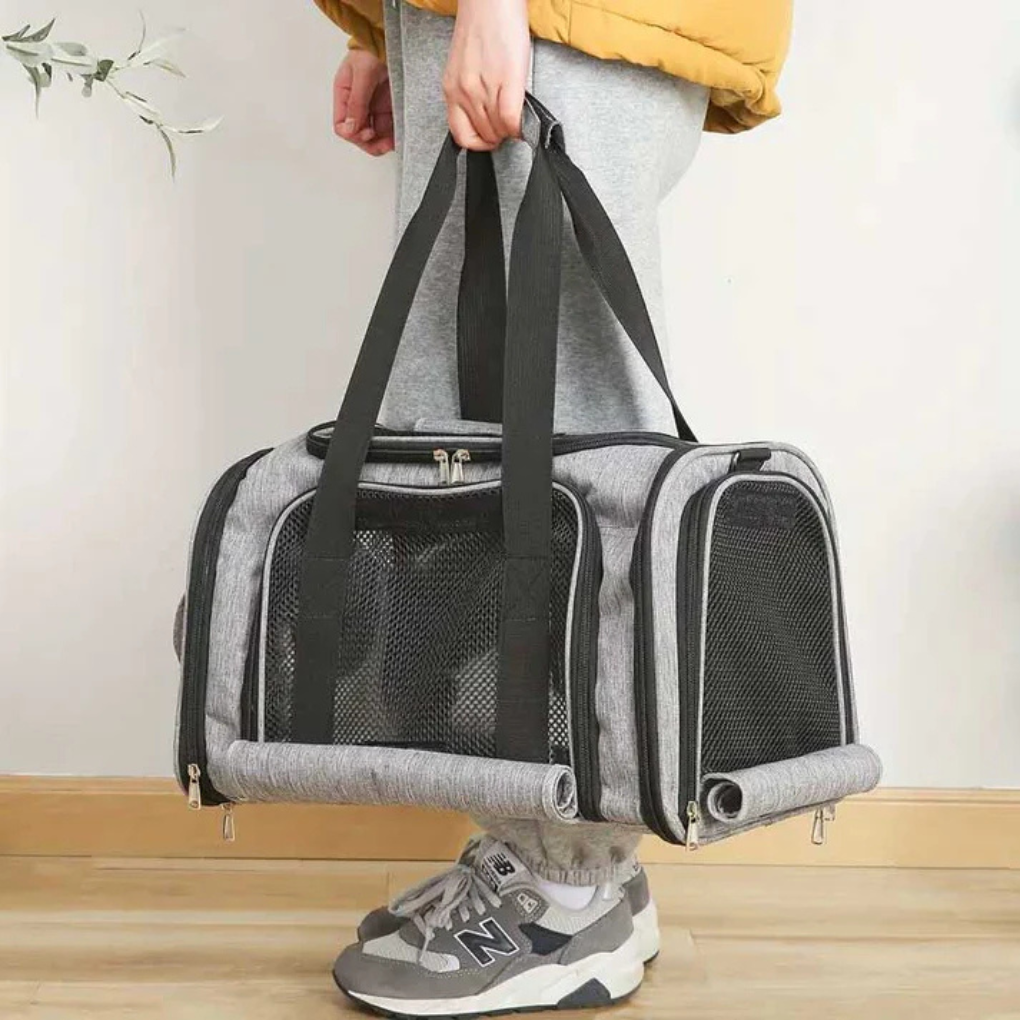 New pet carrier, perfect for travel with small pets, includes carrying handles and meets airline requirements.
