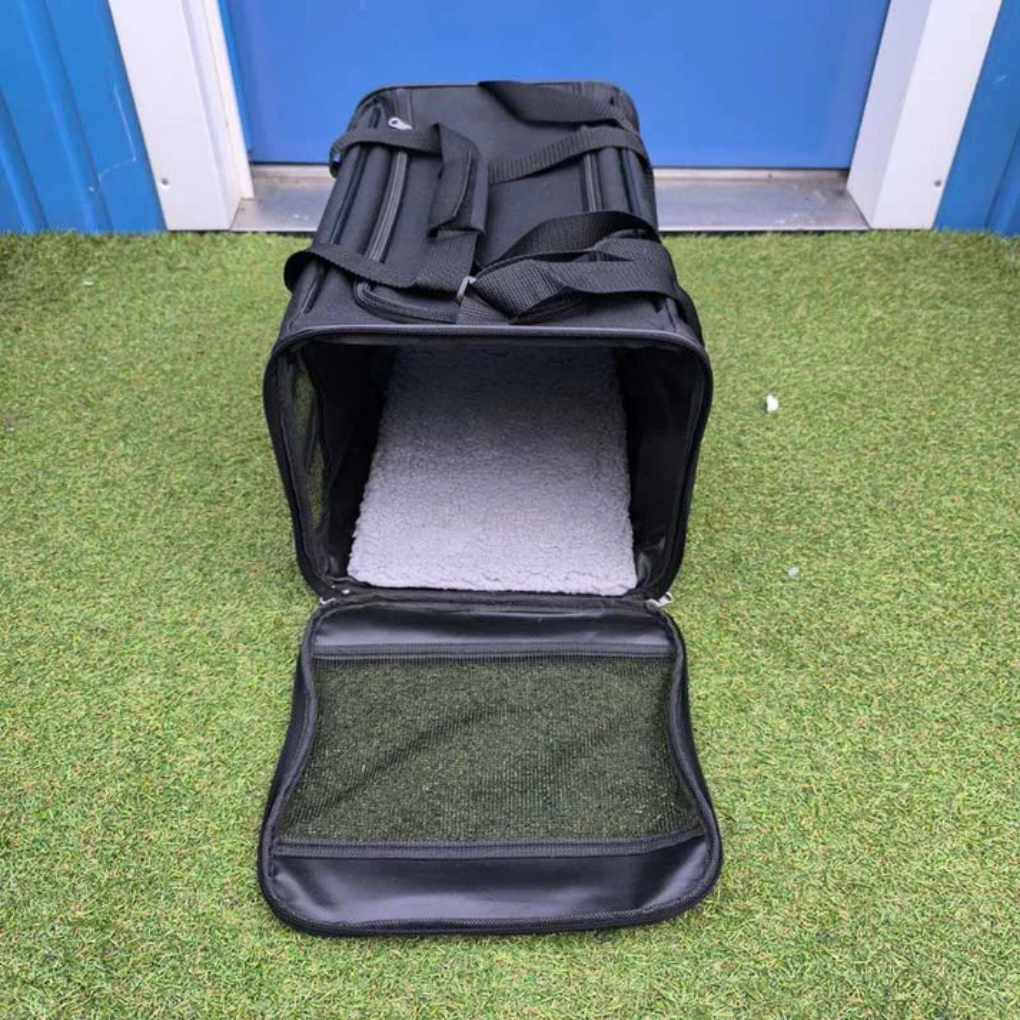 Portable pet travel bag designed for air cabin use, featuring secure zippers and ample pet space.
