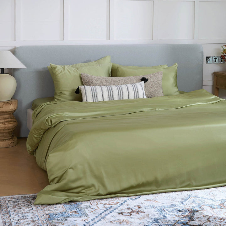 Eco-friendly bamboo bedding draped over a bed, illustrating its natural drape and feel