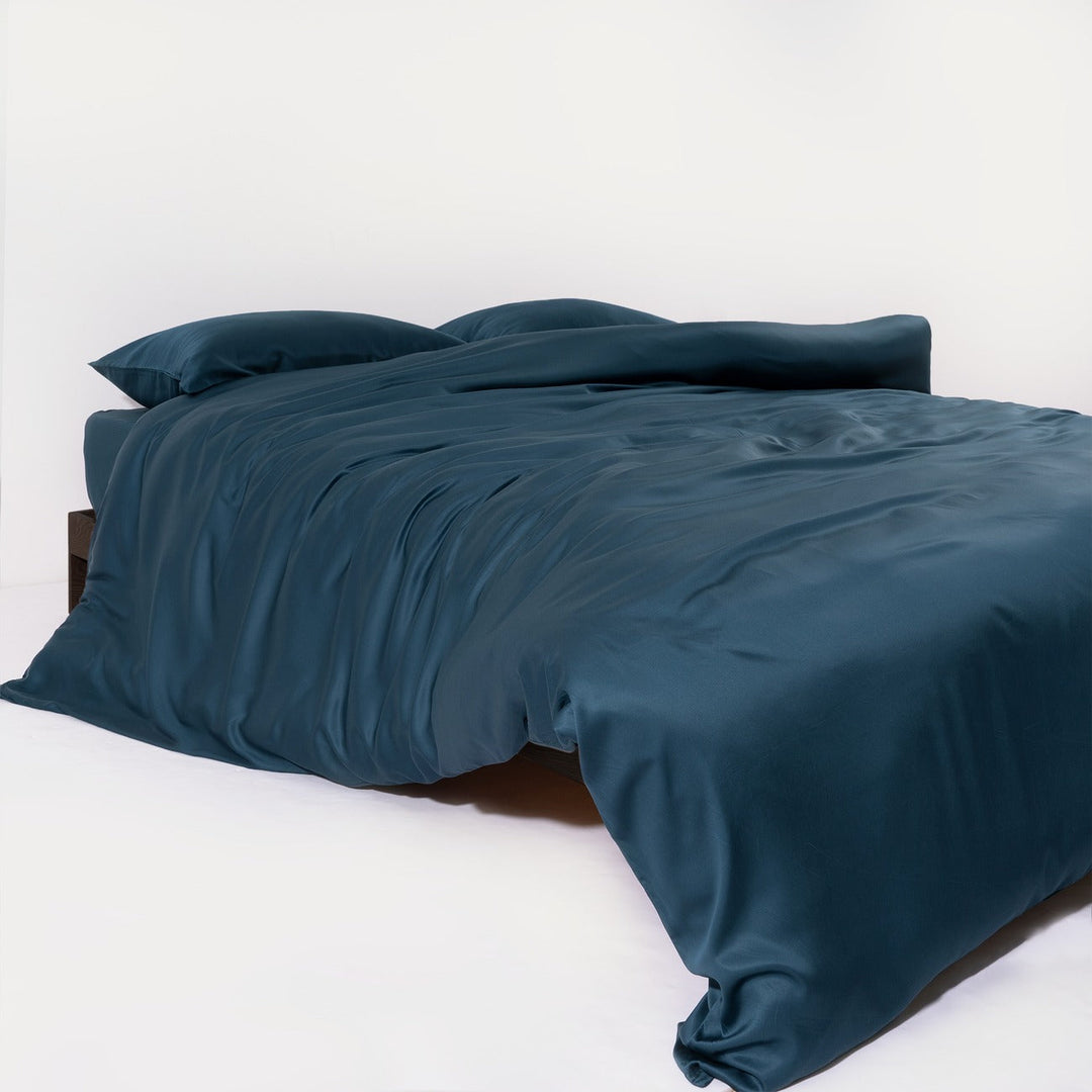 Hypoallergenic bamboo bedding in a light, airy bedroom, emphasizing natural comfort