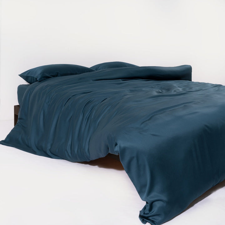 Hypoallergenic bamboo bedding in a light, airy bedroom, emphasizing natural comfort
