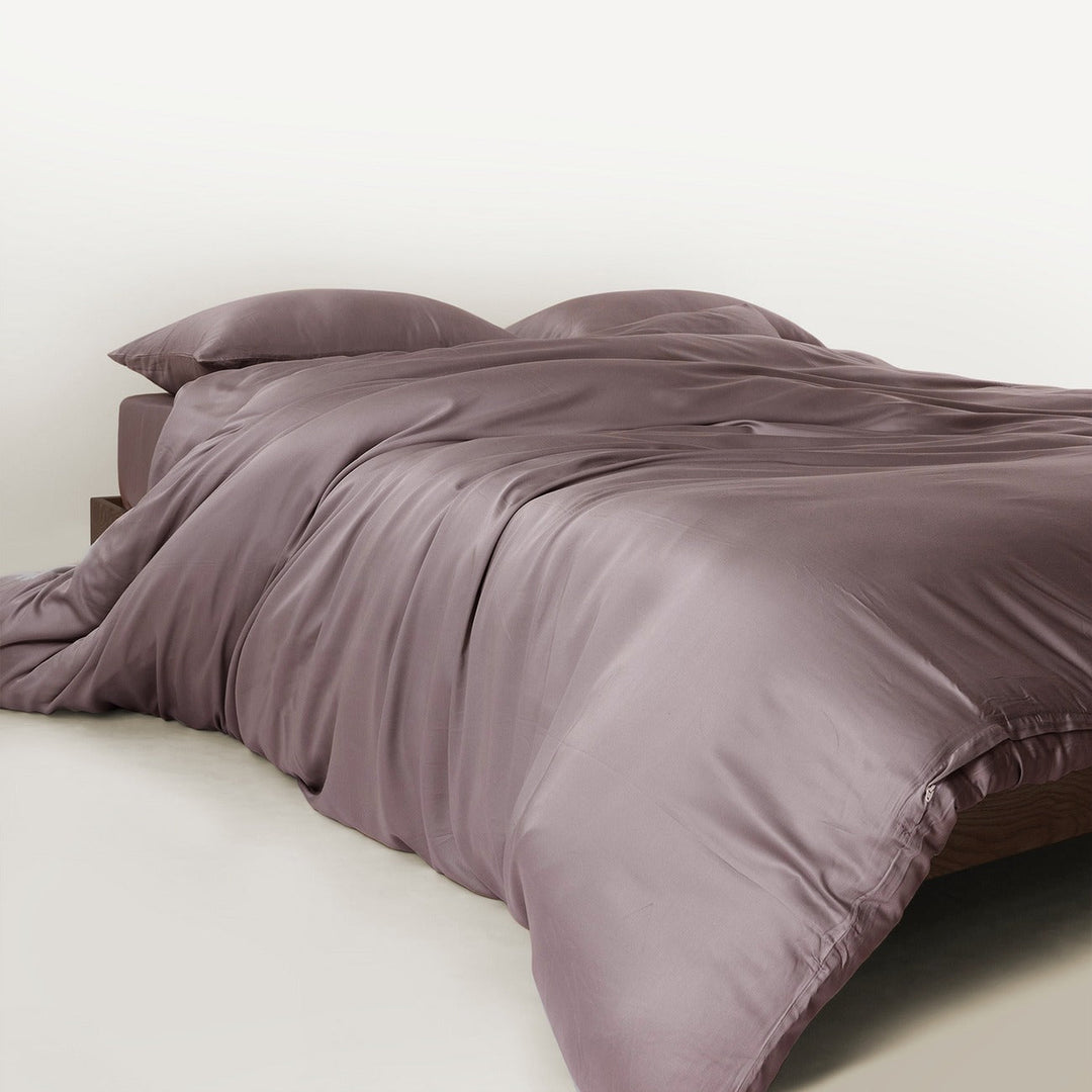 Child and dog comfortably on bamboo bedding set, highlighting family-friendly features