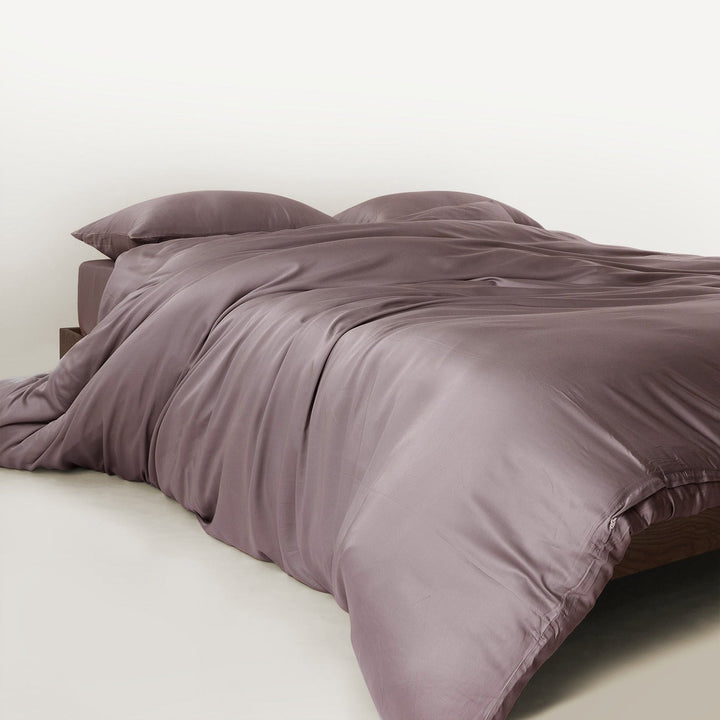 Child and dog comfortably on bamboo bedding set, highlighting family-friendly features