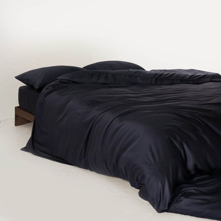 Stack of folded bamboo sheets and pillowcases, showing soft texture and quality