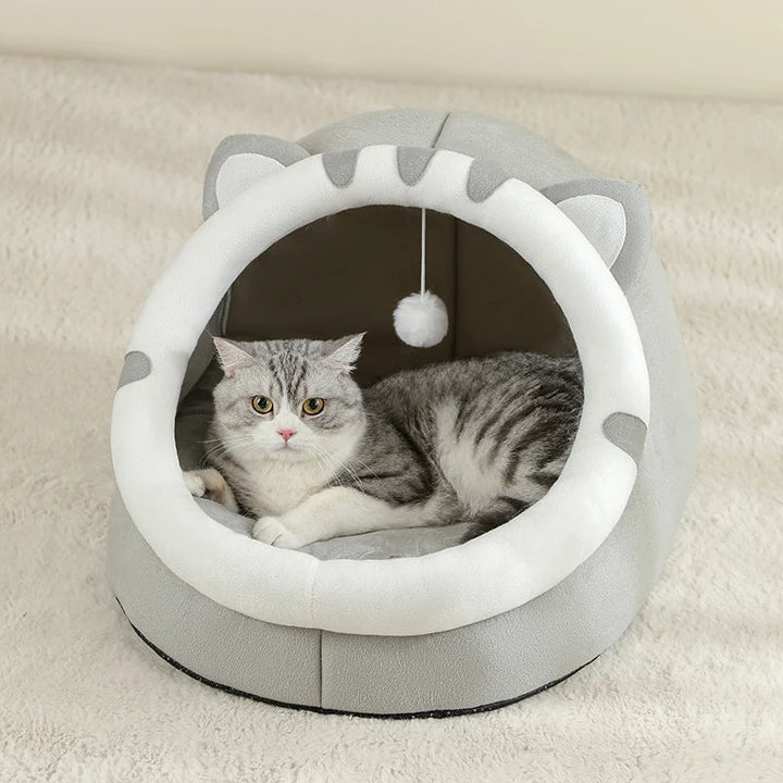 Machine washable pet cave bed with a plush cotton interior, perfect for small pets to nestle in.