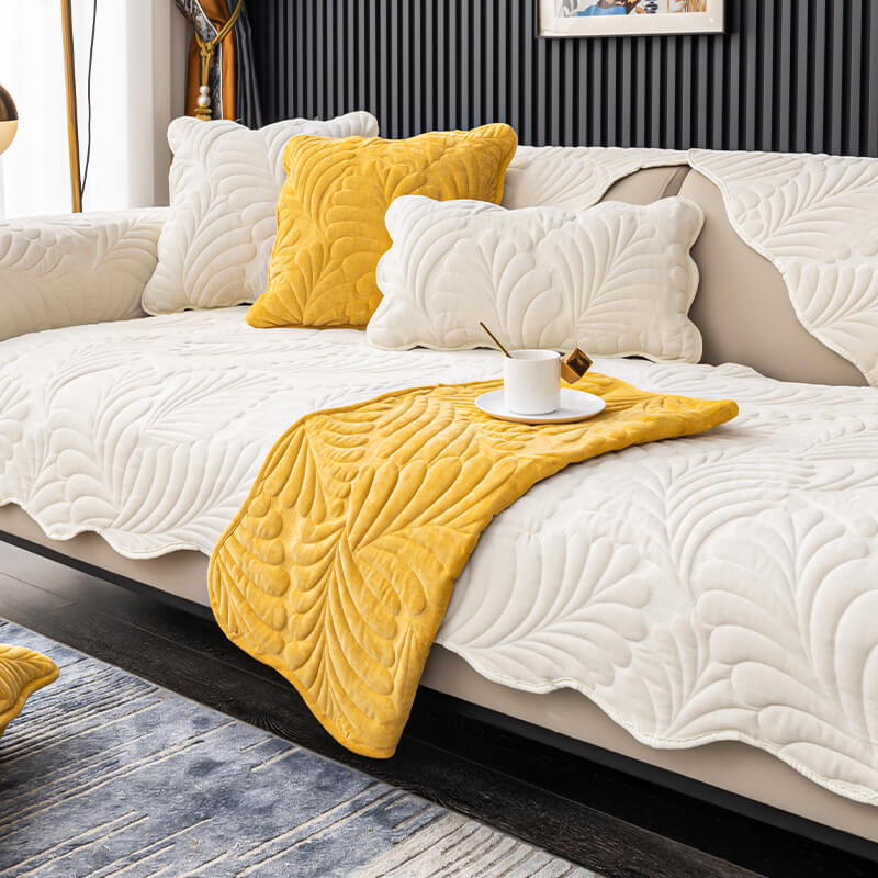 Modern leaf pattern sofa slipcover, crafted from soft cotton. Protects furniture while elevating home decor.
