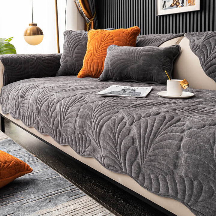 Anti-scratch cotton couch cover in a vibrant leaf pattern, perfect for families with pets. Easy to wash.