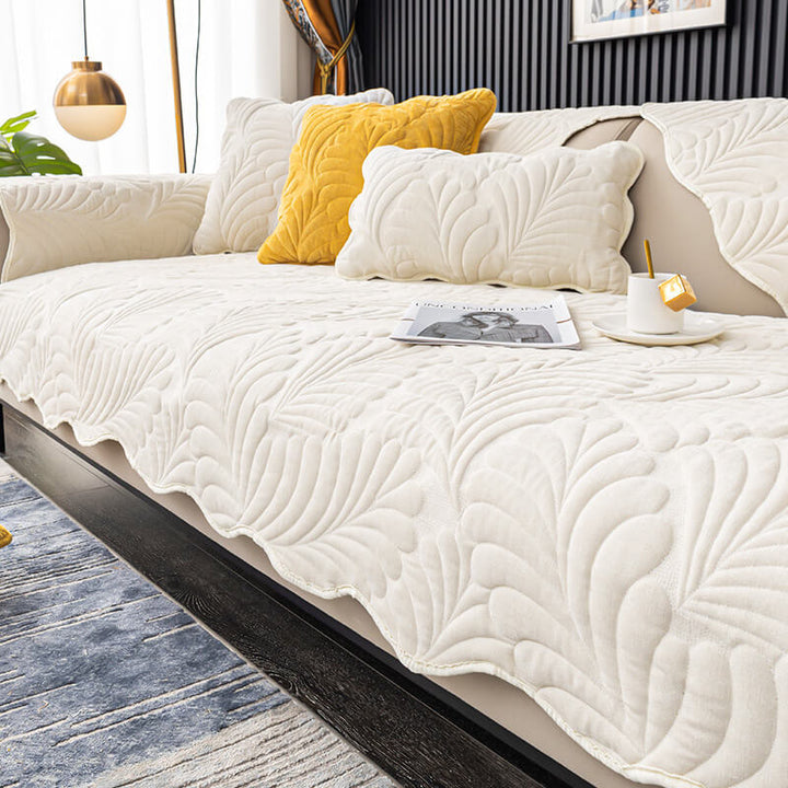 Comfortable cotton couch cover with a nature-inspired leaf pattern, ensuring a non-slip fit and easy maintenance.