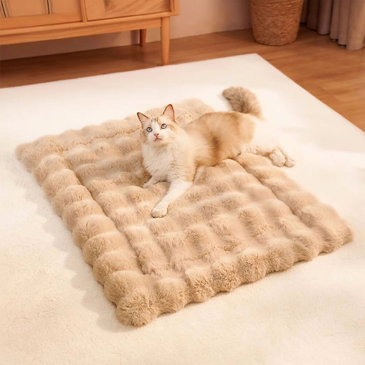 Detailed view of the wave pattern pillow on a faux rabbit fur pet bed, luxury pet mat
