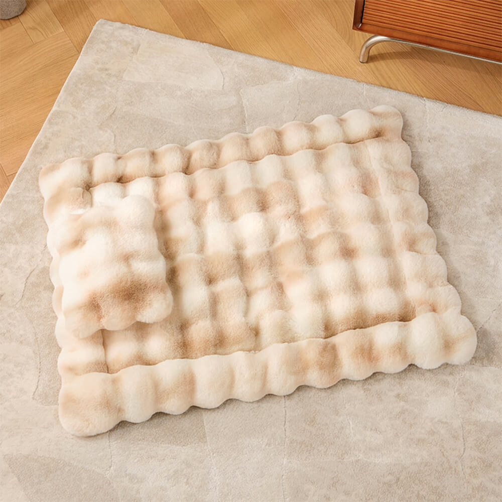 Top-down view of a grey faux rabbit fur pet mat with pillow, soft cat bed accessory