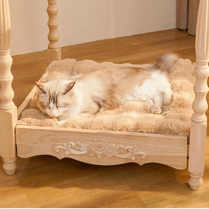 Cat napping on a plush faux rabbit fur pet bed, cozy mat with wave pattern pillow