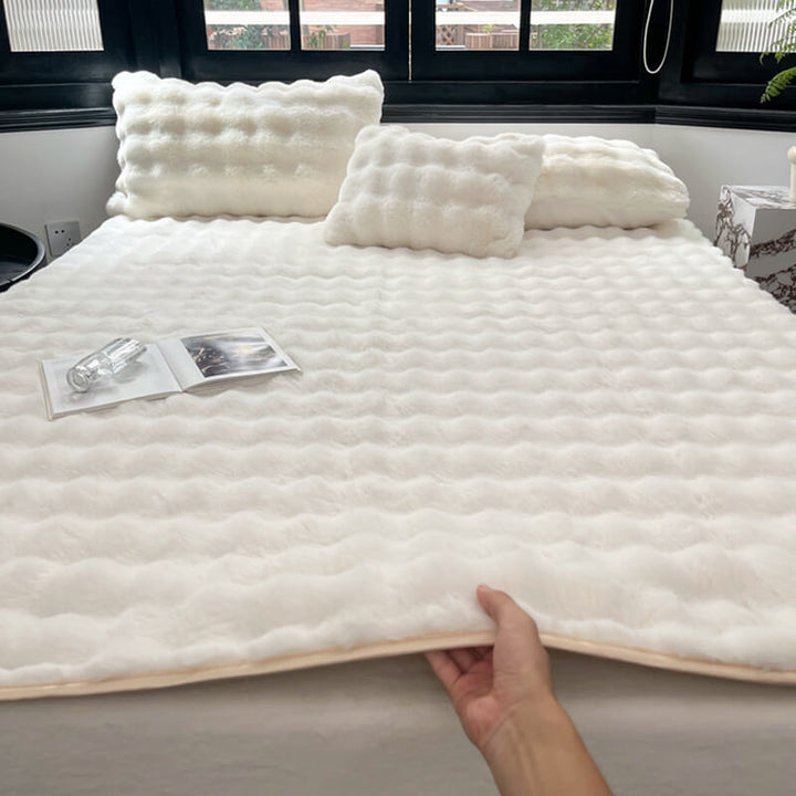 Soft faux rabbit fur mattress cover, non-slip, fitted sheet style for ultimate bedroom comfort.