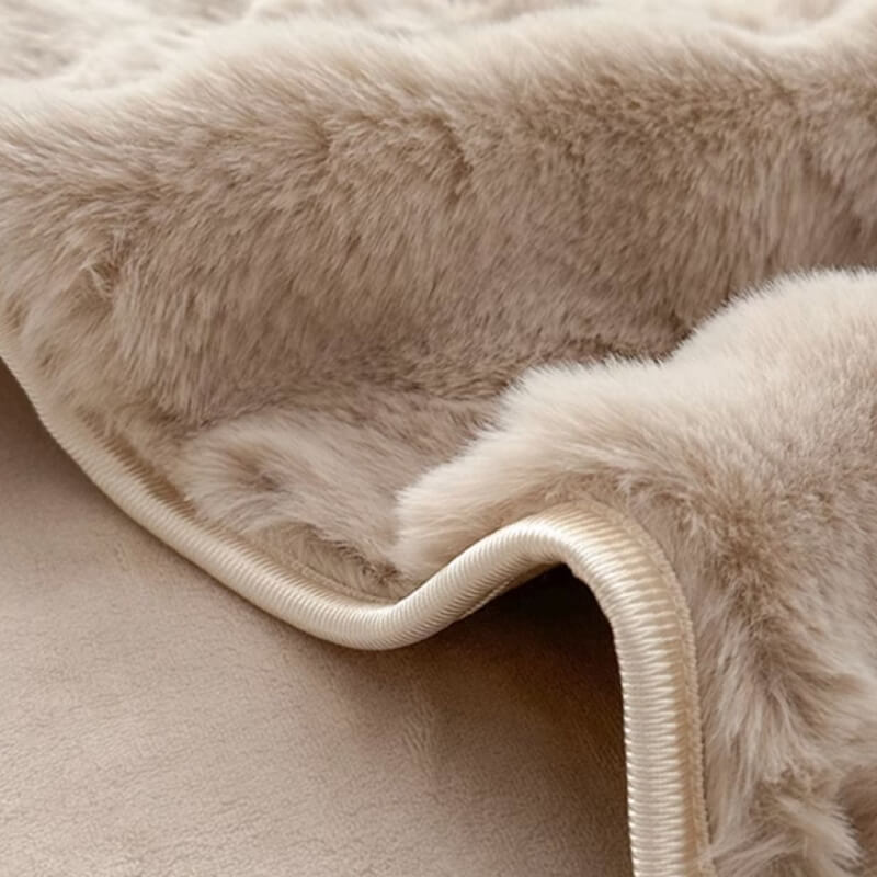 Close-up of soft faux rabbit fur texture on a non-slip fitted mattress cover, cozy bedroom decor.