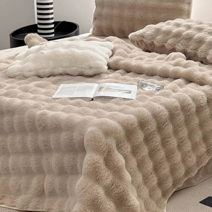 White faux rabbit fur fitted mattress cover, non-slip, shown on a bed, premium bedding comfort.