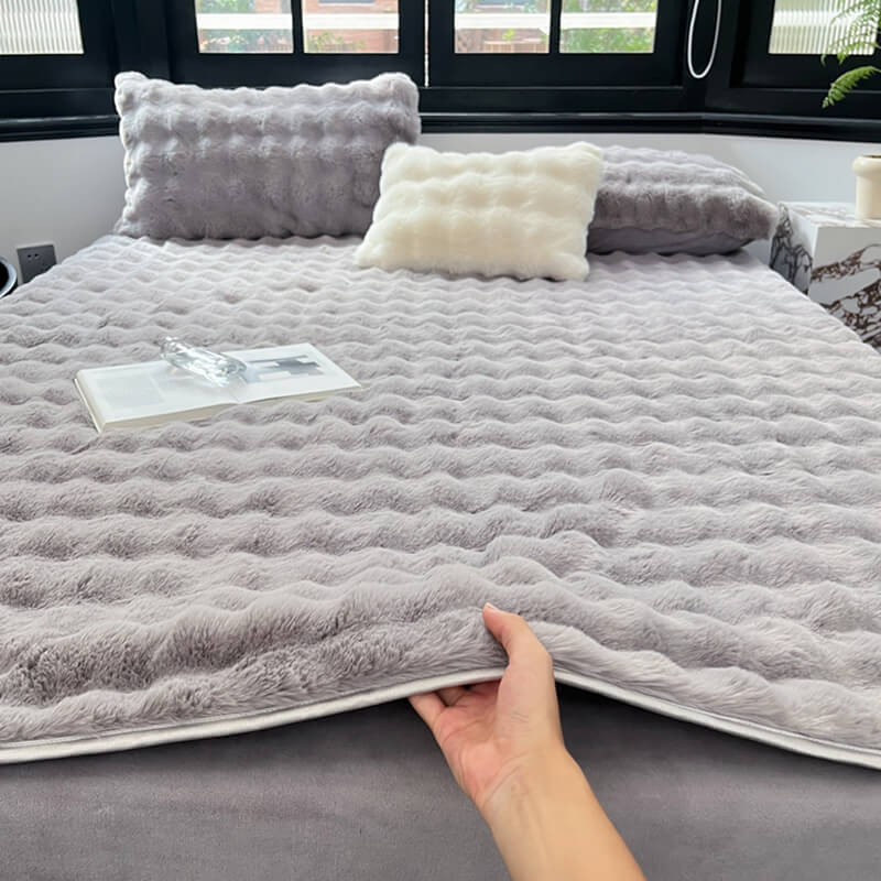 Tan faux rabbit fur mattress cover, soft, non-slip fitted sheet for elegant bedroom decor.