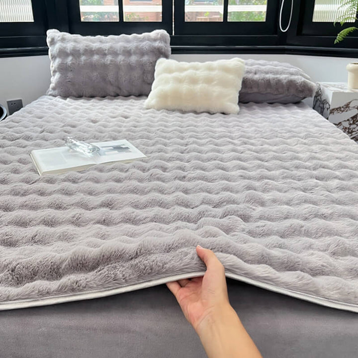 Tan faux rabbit fur mattress cover, soft, non-slip fitted sheet for elegant bedroom decor.