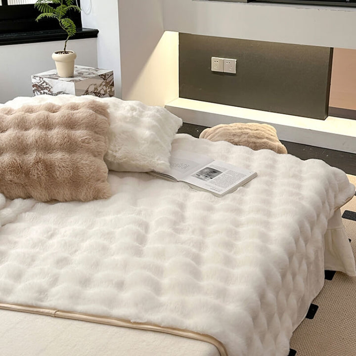 Soft faux rabbit fur mattress cover, non-slip design, adding comfort and style to bedding.