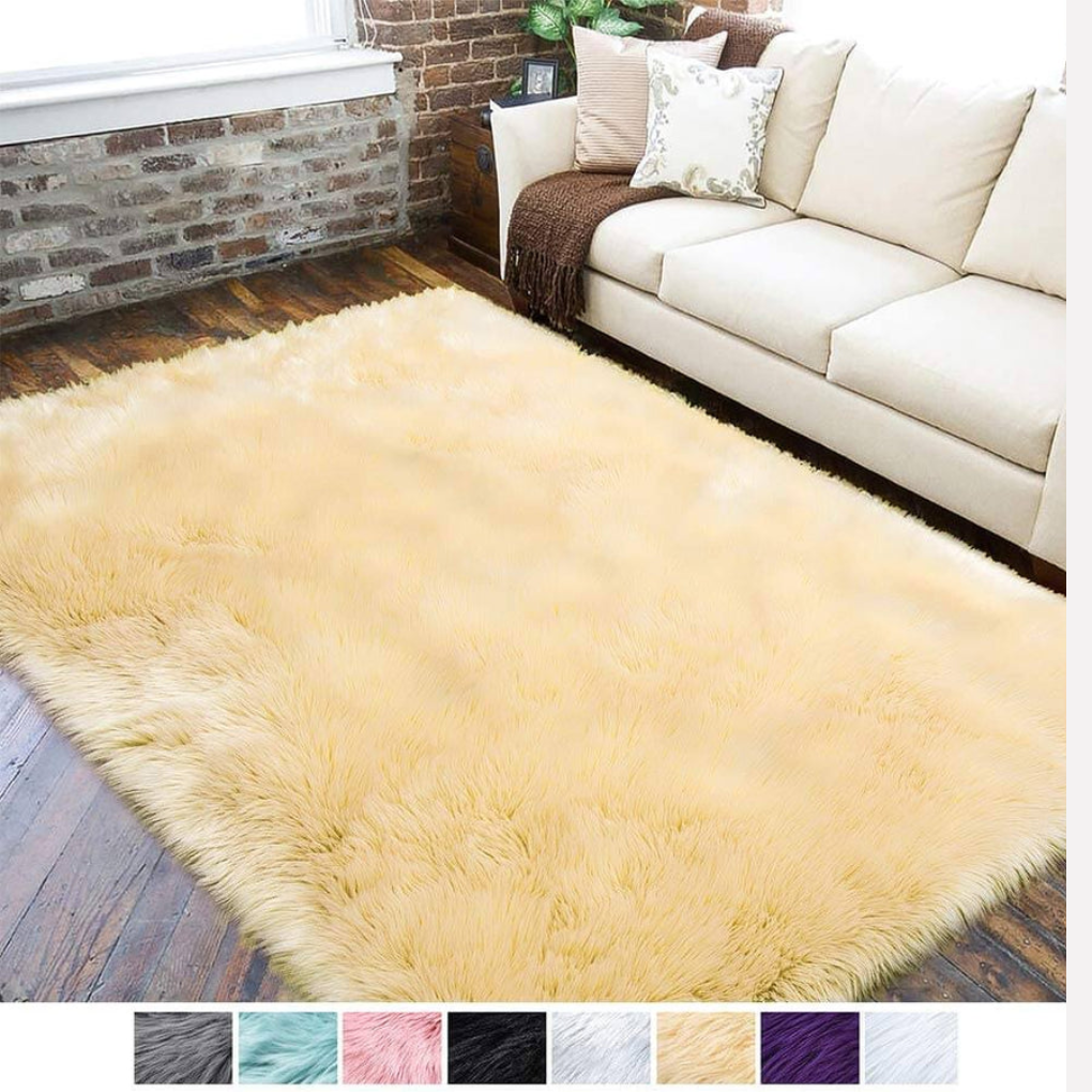 High pile white faux sheepskin rug, soft underfoot, enhances bedroom
