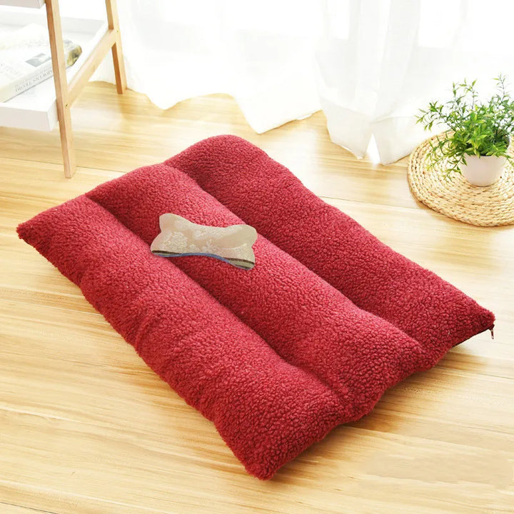 Washable dog bed with soft fleece, perfect pet accessory for travel and indoor relaxation.