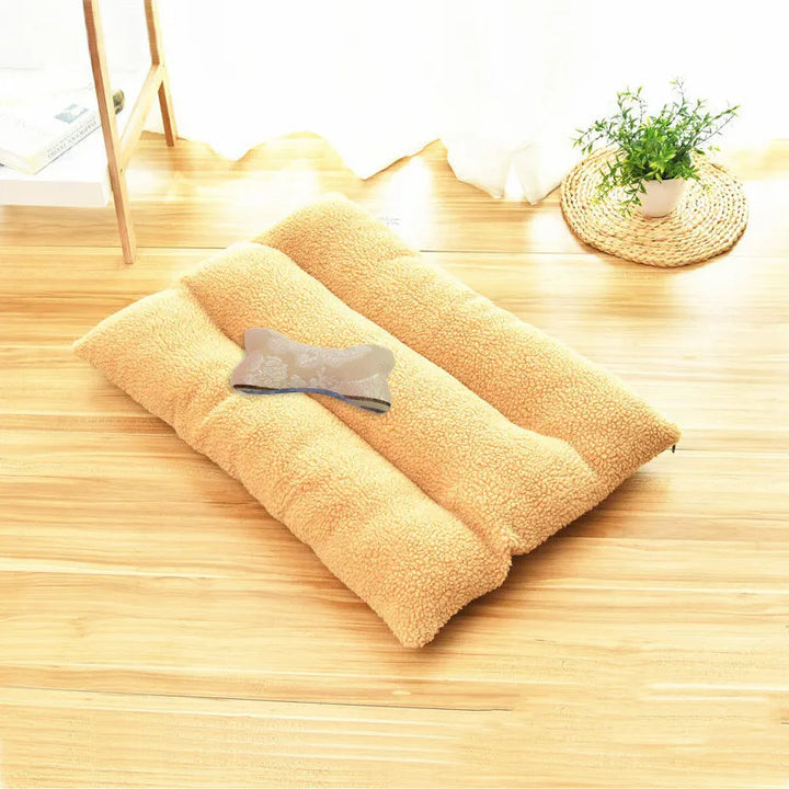 Comfortable dog cushion made of warm fleece, ideal for small dogs napping in their pet bed.