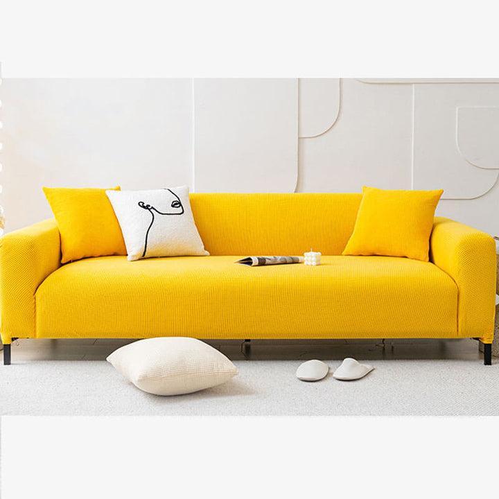 Stretchable 2-seater couch cover made from soft fleece, protecting furniture, machine washable for easy care