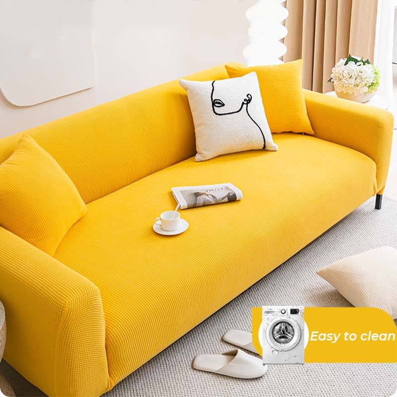 Living room with a stylish fleece couch cover, offering furniture protection and a touch of elegance