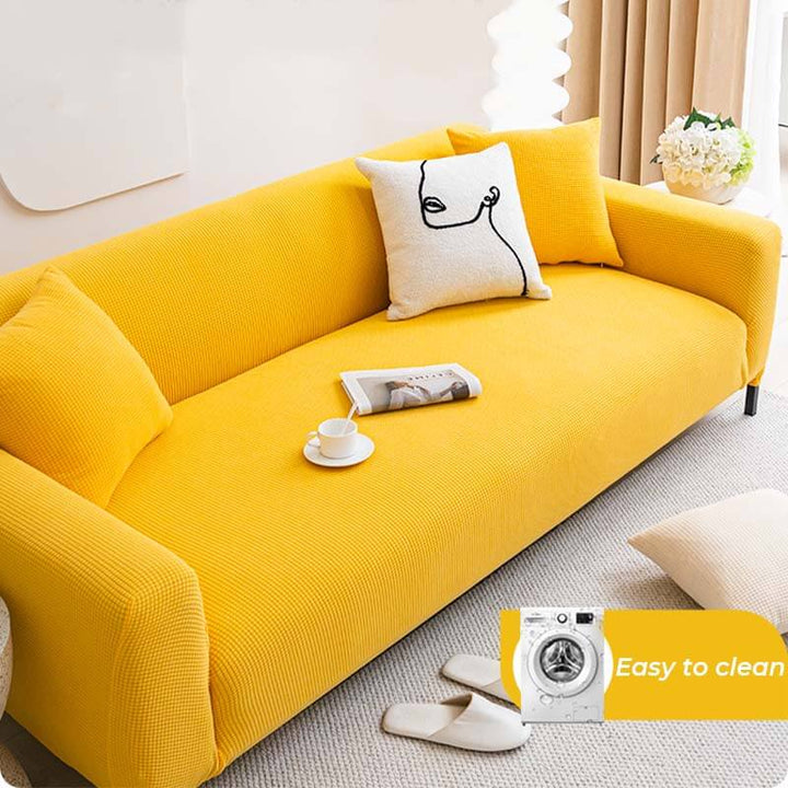 Living room with a stylish fleece couch cover, offering furniture protection and a touch of elegance