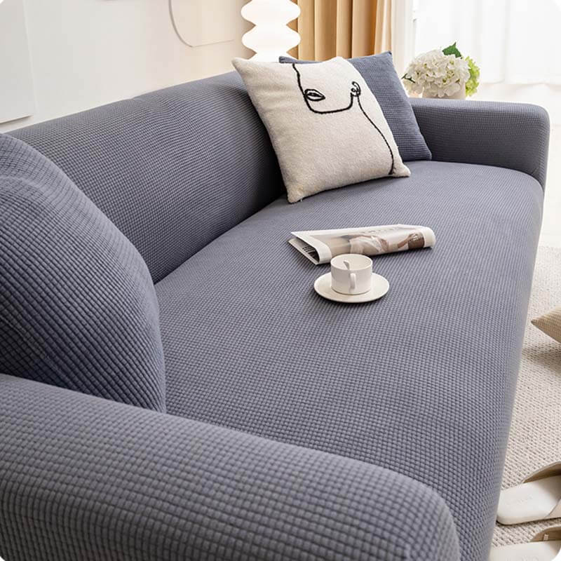 Soft stretch couch cover in fleece, ideal for pet owners, providing complete furniture protection and easy maintenance