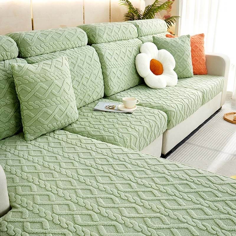 Soft fleece stretch couch cover in a full wrap design, protecting a sofa with a cozy feel.