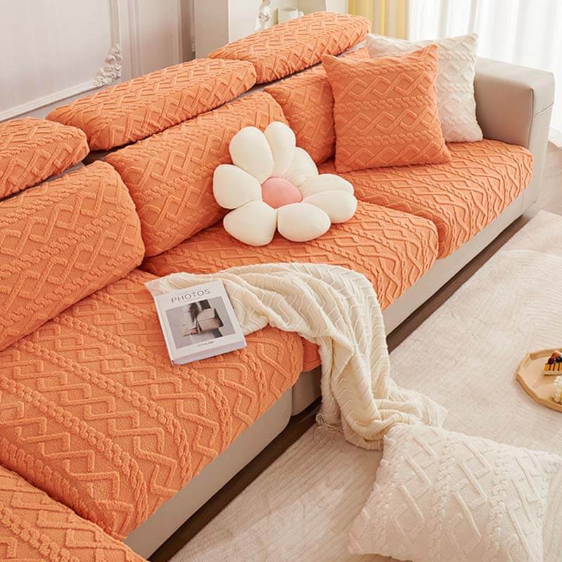 Corner detail of a full wrap fleece couch cover showing its stretchability and pet-friendly design.