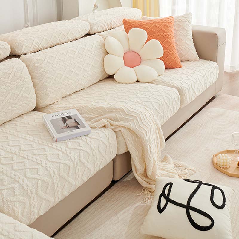 Stylish full wrap stretch couch cover in a neutral color, offering pet-friendly sofa protection.