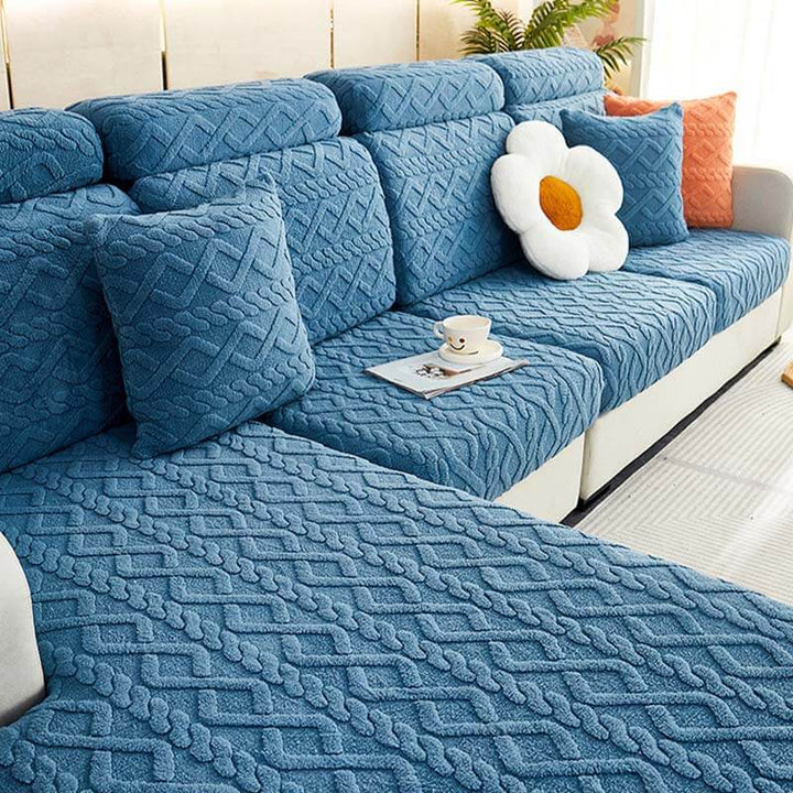 Front view of a couch adorned with a soft fleece stretch sofa protector, enhancing home decor.