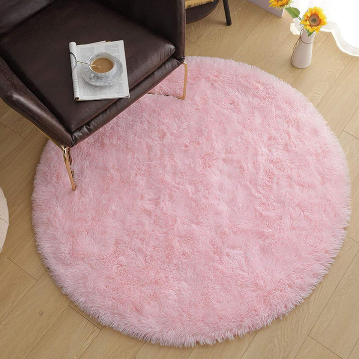 Beautiful round faux fur rug adding warmth and softness to any room's decor.