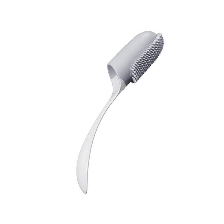 Pet finger toothbrush next to pet dental treats, emphasizing a holistic approach to dog and cat oral hygiene.