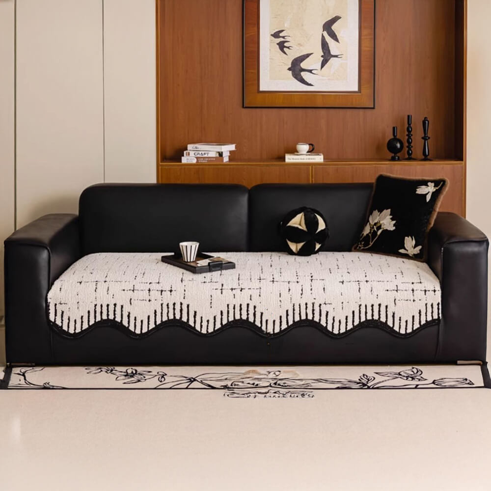 Thickened plush sofa protector with stylish wave edges, easy care home decor.
