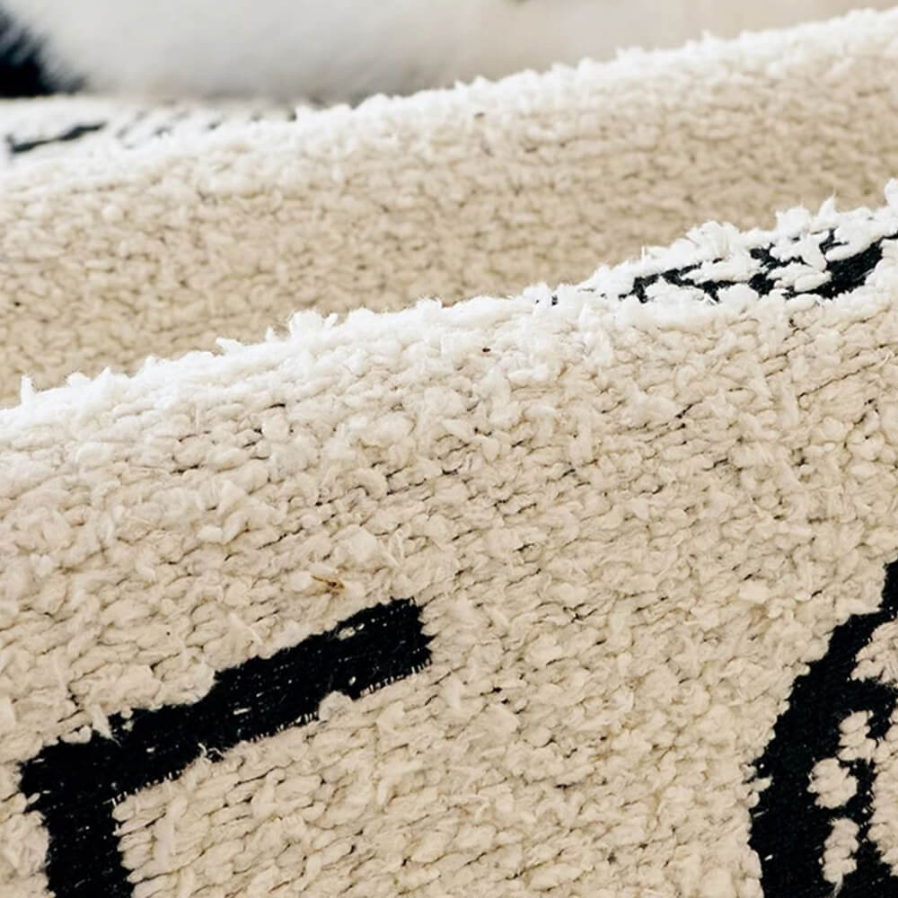 Plush couch cover for furniture protection, showing its irregular wave design.
