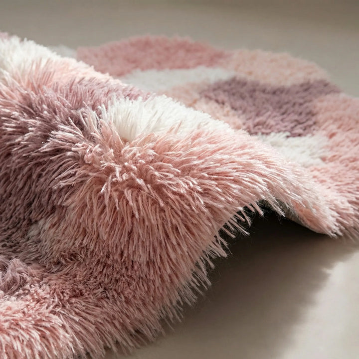 Plush, soft sculpted area rug in pastel tones with organic wave pattern. Perfect for cozy living room or bedroom decor.
