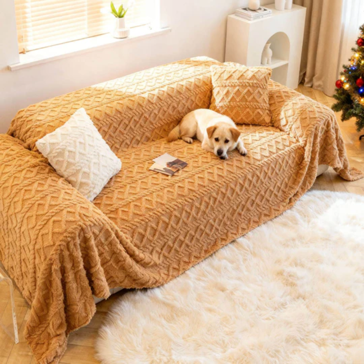 Beige shaggy furniture protector draped on a two-seater couch, emphasizing its soft, pet-friendly design.